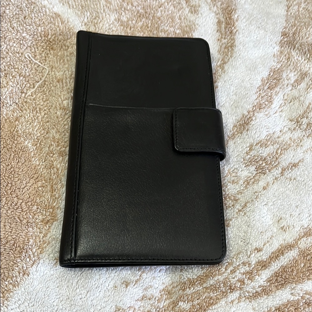 Sleek Black Leather Wallet with Tab Closure